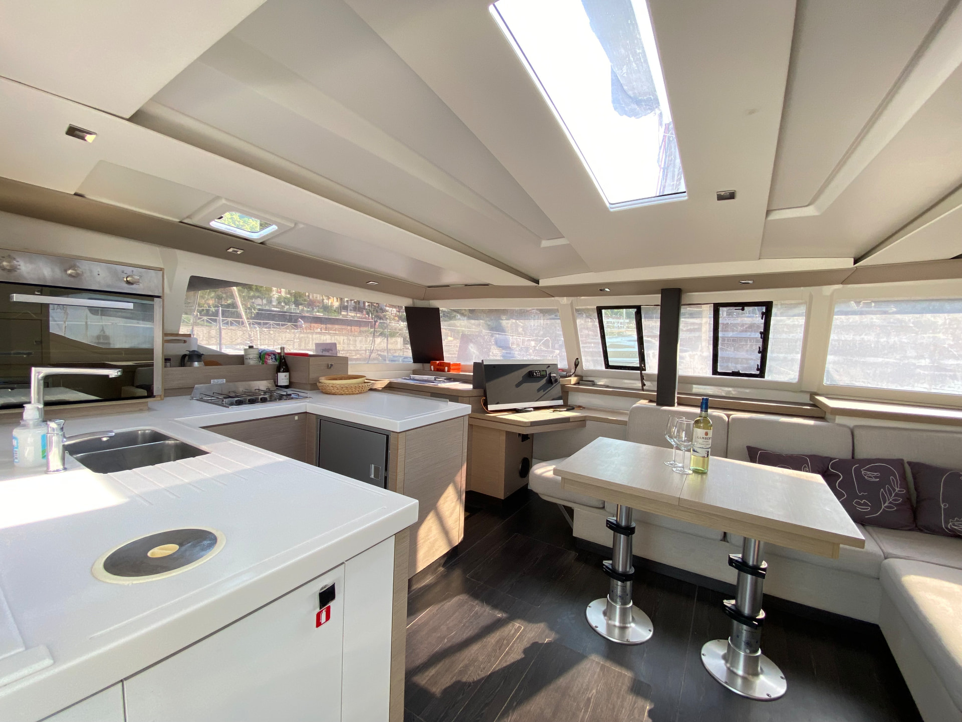 Bright saloon and galley of the catamaran